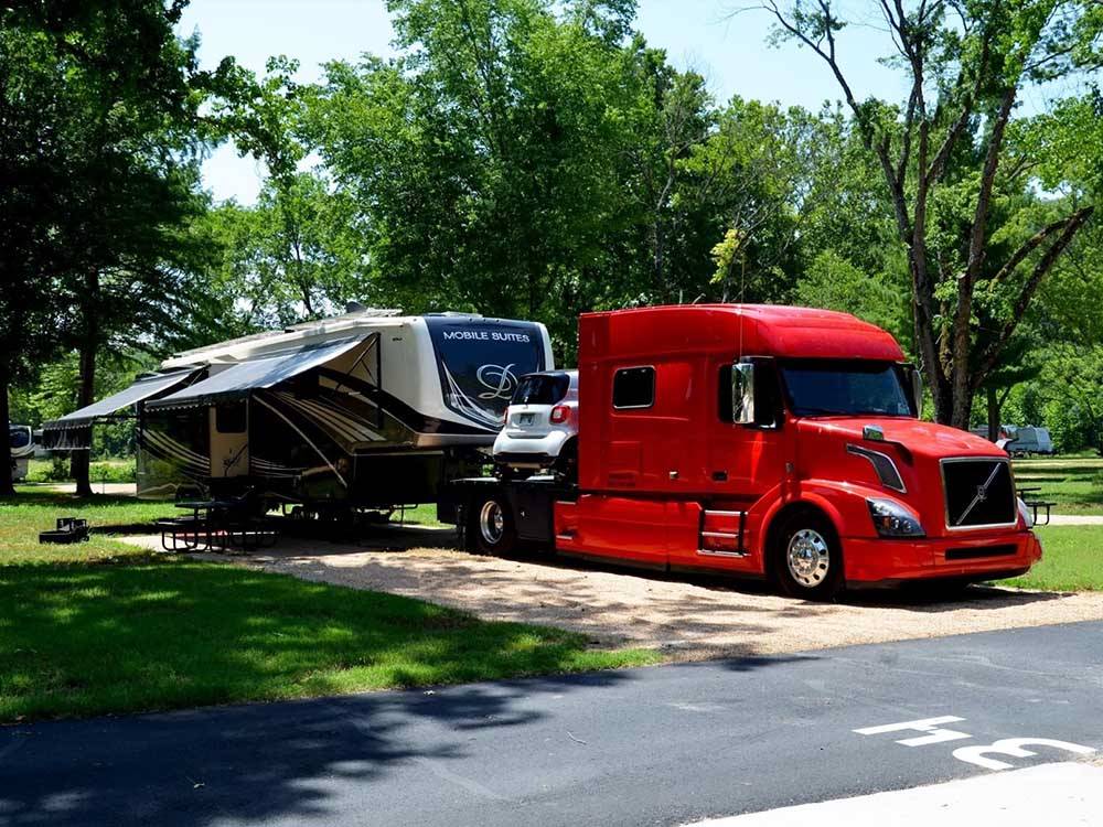 A fifth wheel backed in at BULL CREEK RV PARK