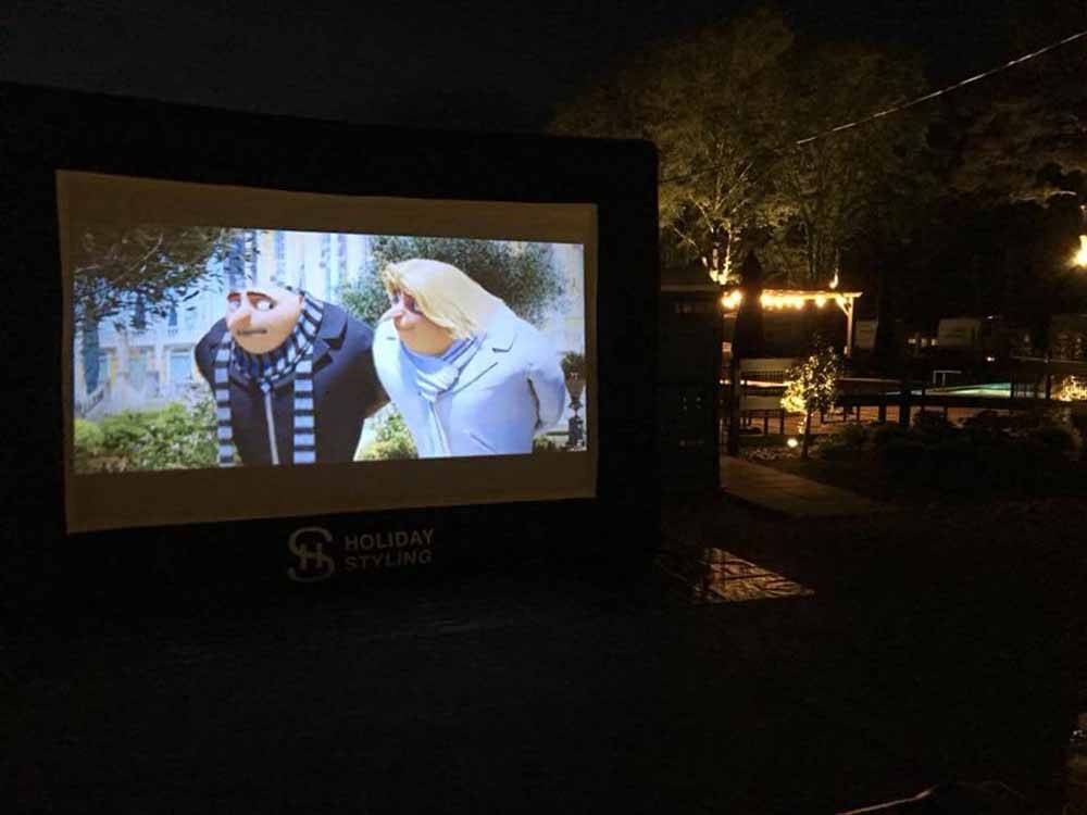 Outdoor movie screen at MAJESTIC PINES RV RESORT