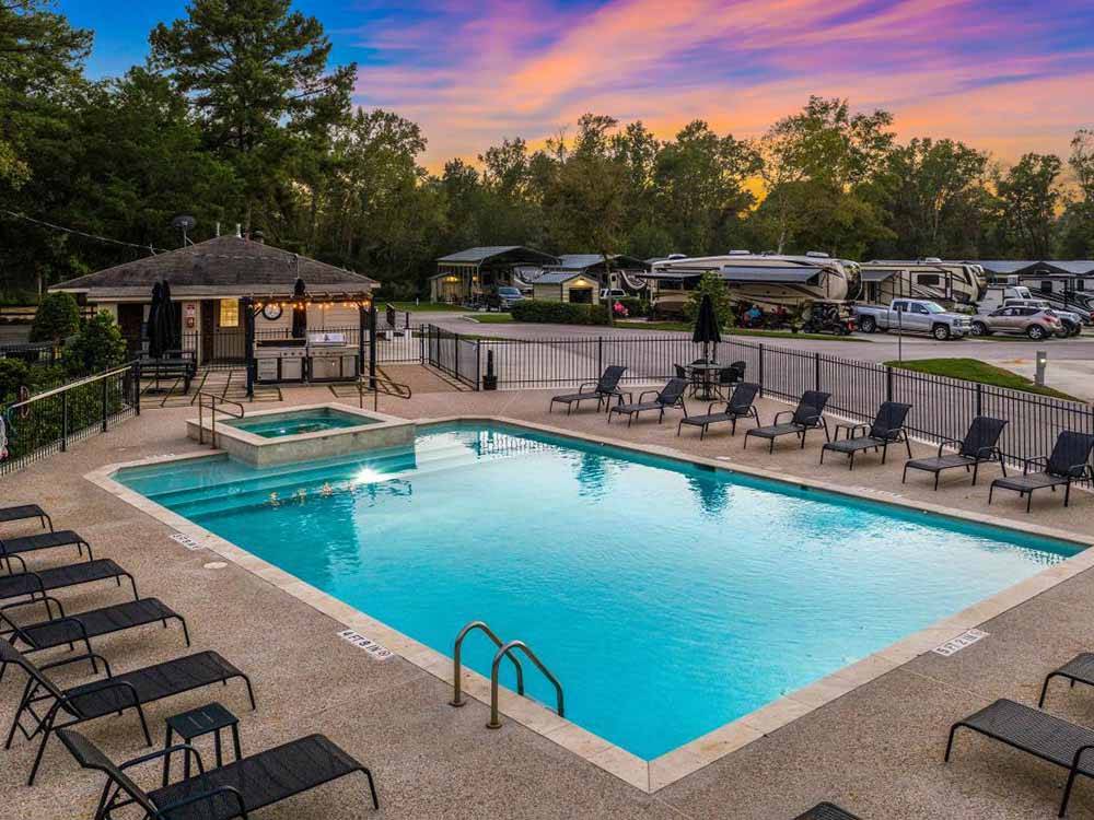 View of pool with beautiful sky at MAJESTIC PINES RV RESORT