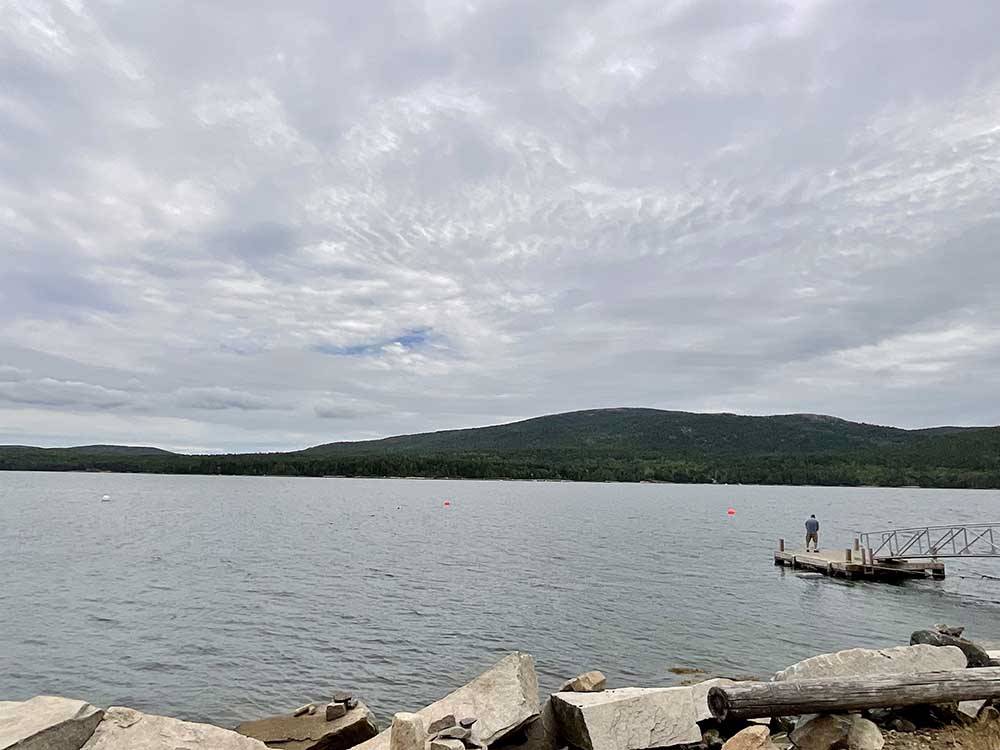 A man standing at the end of the dock at HTR ACADIA