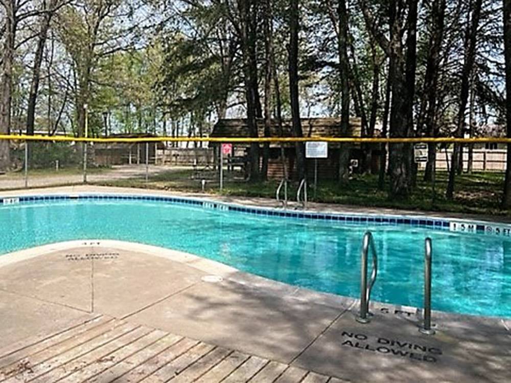 The fenced in swimming pool at ELKHART RV RESORT BY RJOURNEY