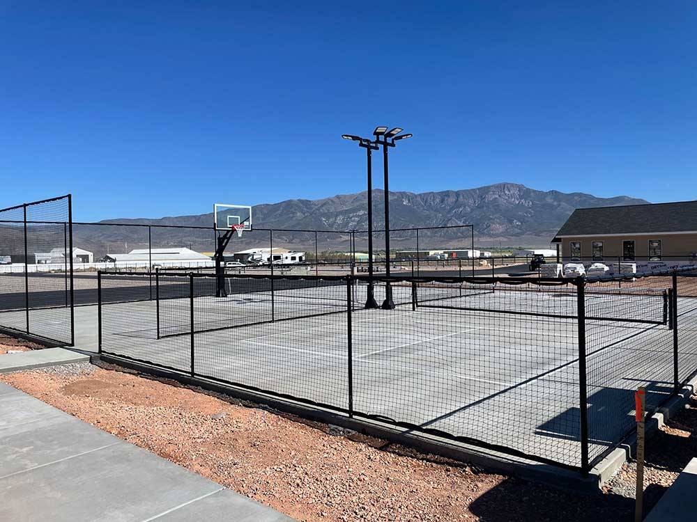 Basketball net and tennis court at VENTURE RV PARK
