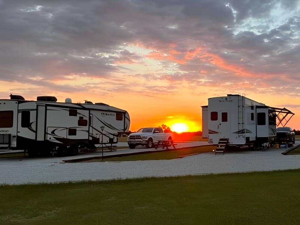 RVs in sites at sunset