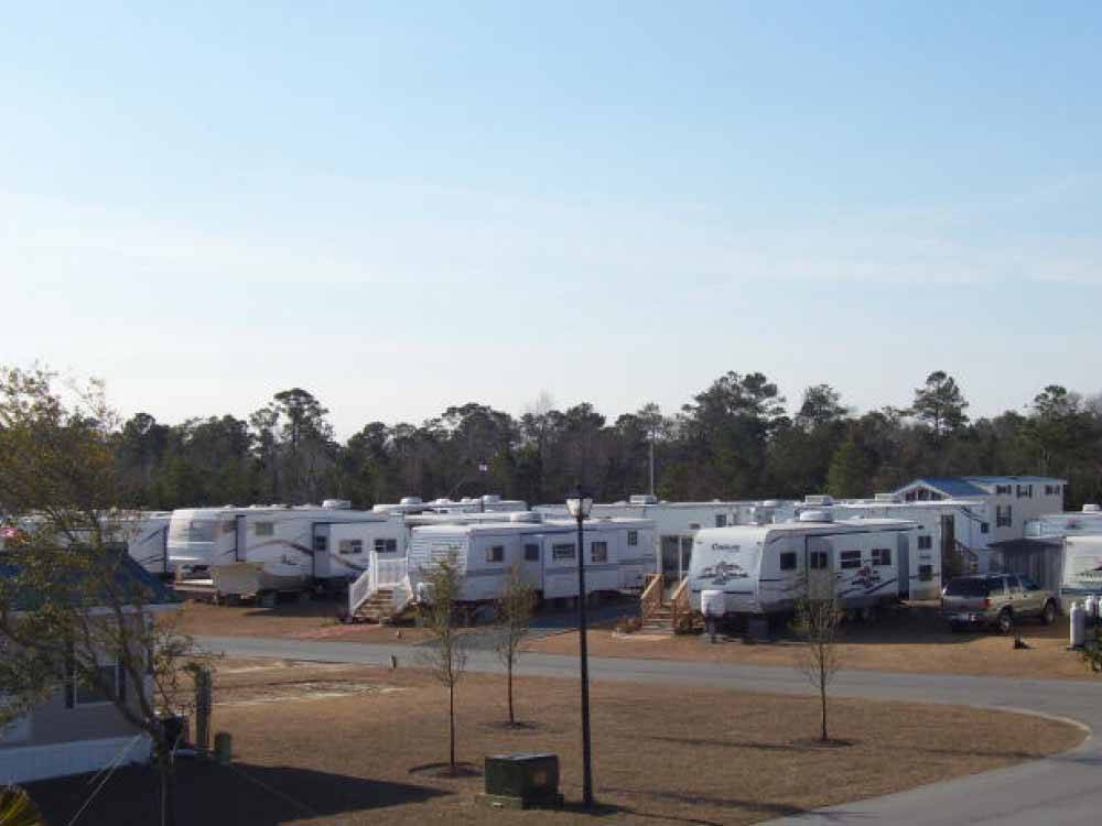 Row of trailers in campsites at TOPSAIL SOUND RV PARK