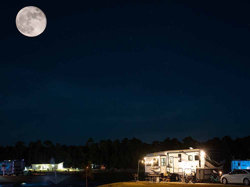 A full moon over the campsites at GULF SHORES RV RESORT
