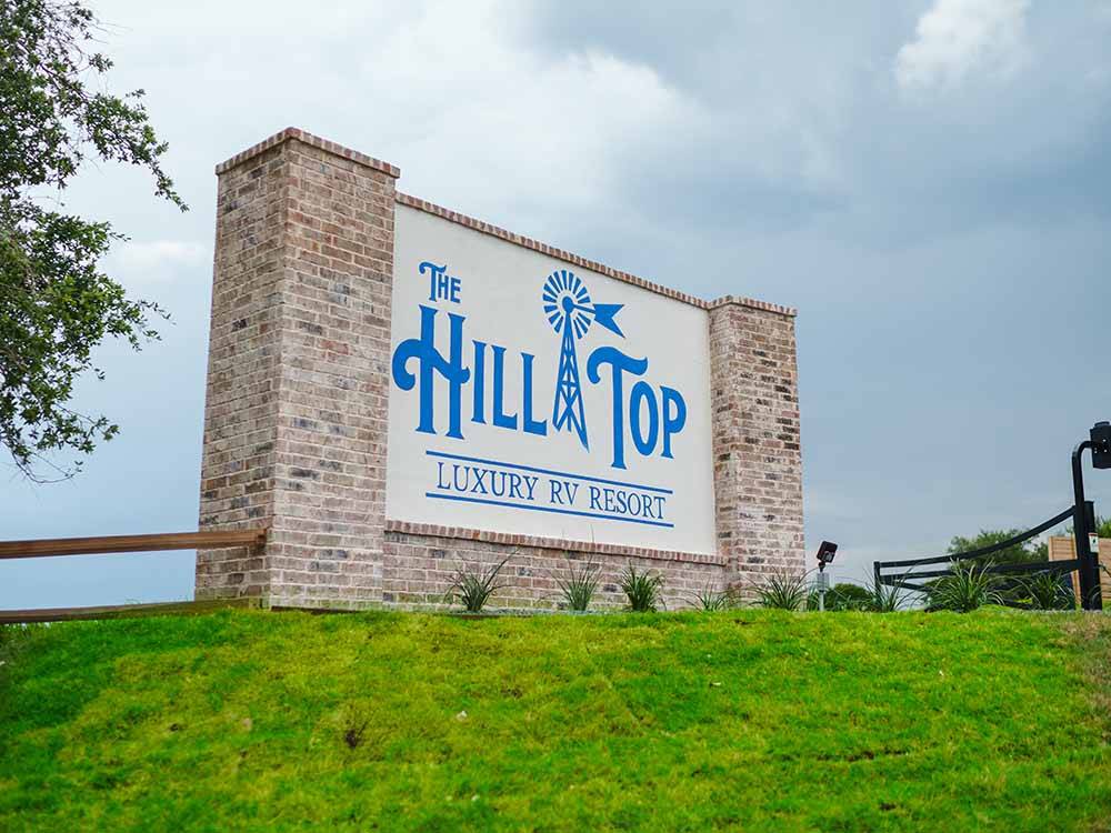The front entrance sign at THE HILL TOP AT BRENHAM RV RESORT