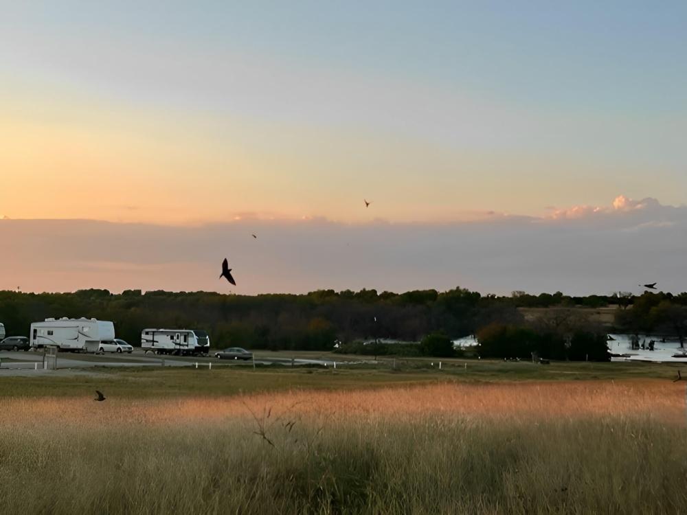 Parked trailers at site Cherokee Creek RV Park