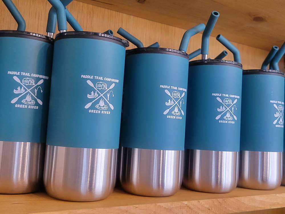 Drinking cups with the campground logo on them at PADDLE TRAIL CAMPGROUND ON THE GREEN RIVER