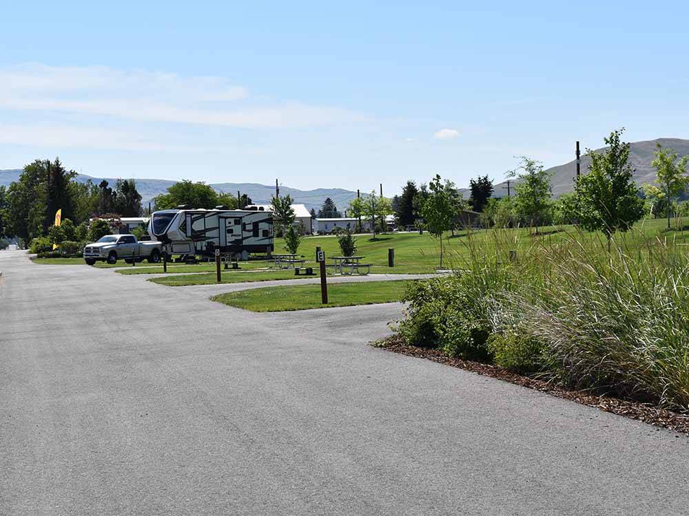 A row of empty paved RV sites at CONKLIN LANDING RV PARK