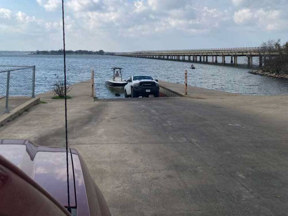 A boat being launched at the boat ramp at BLUE SKY CEDAR CREEK LAKE RV PARK