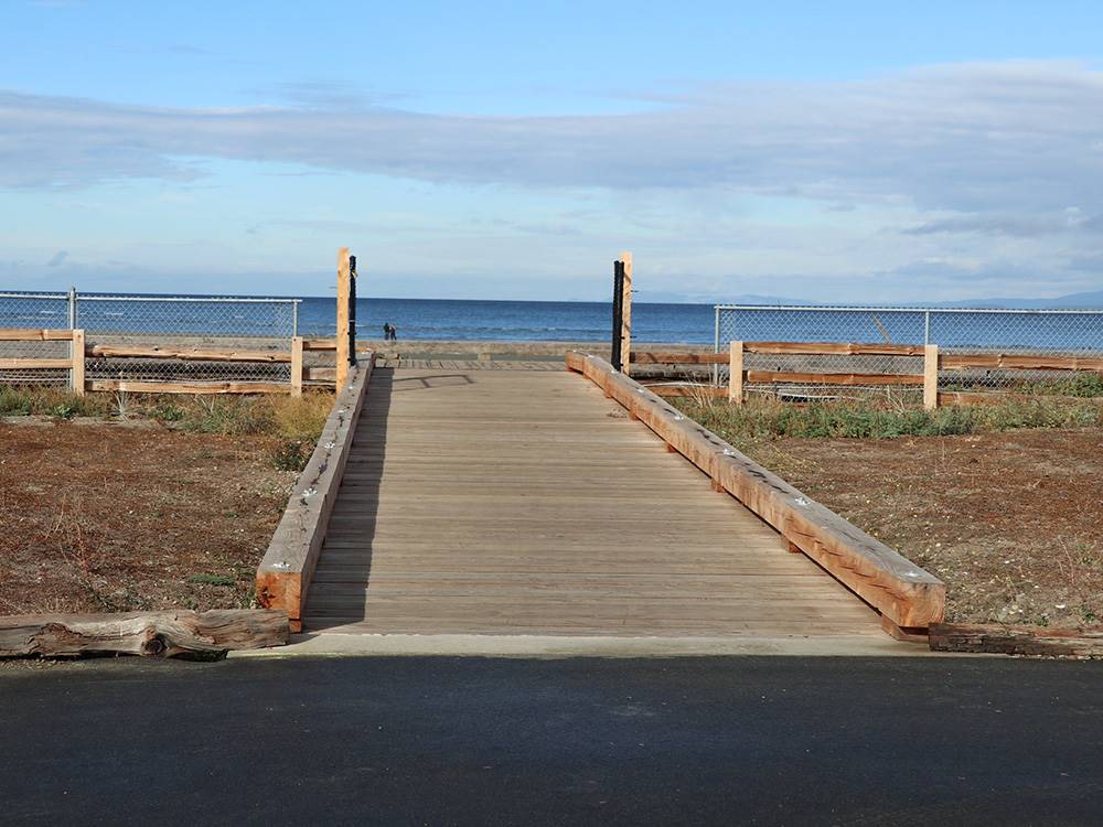 A walking path to the beach at PACIFIC PALMS RV RESORT