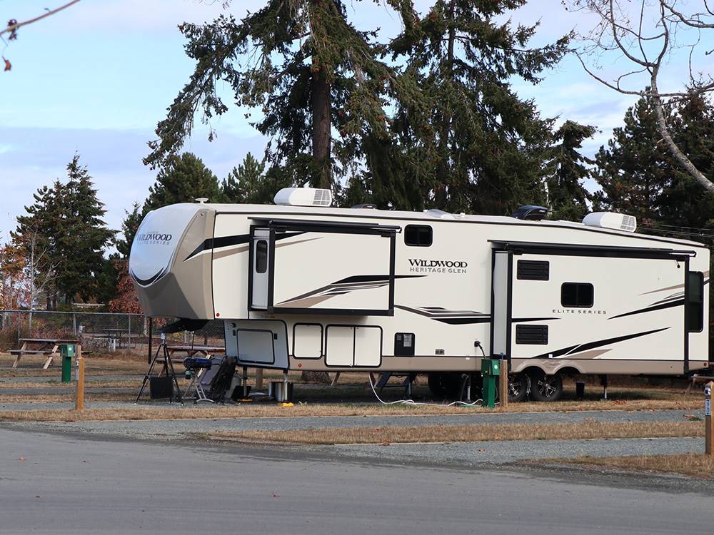 A fifth wheel trailer in a gravel site at PACIFIC PALMS RV RESORT