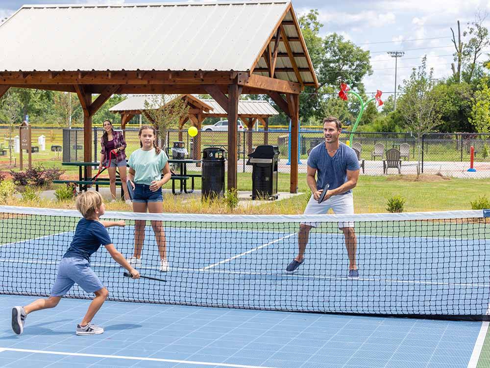 A family playing pickleball at LOVE'S RV STOP - 801