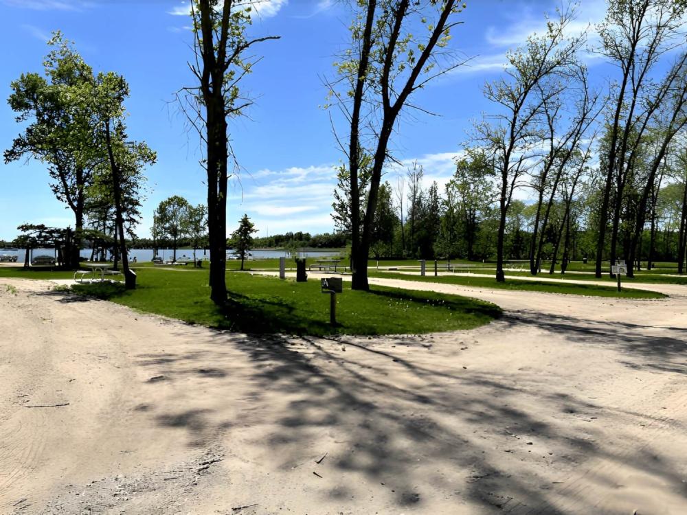 RV site with lawn and trees