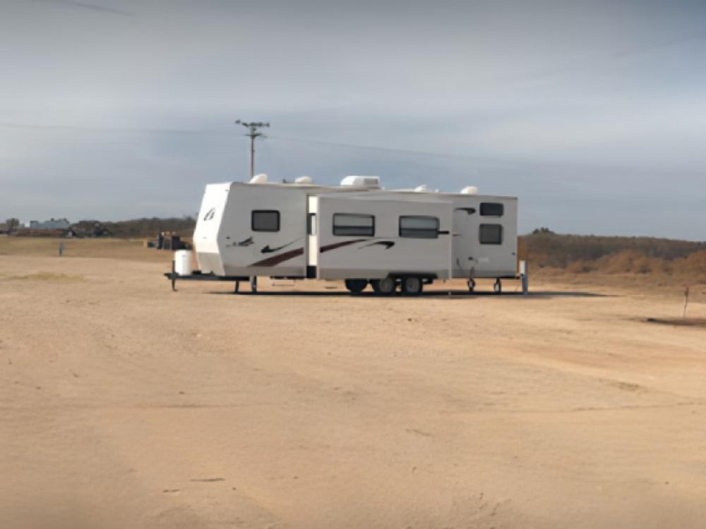 5th wheel in dirt site at Buffalo RV Park