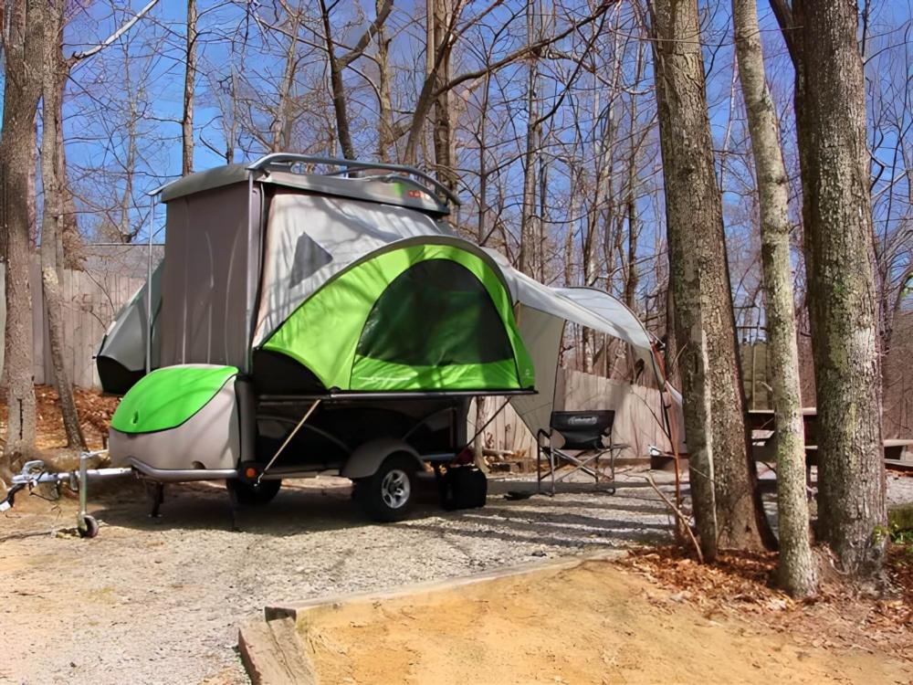 Parked 5th wheel at site Ash Grove Mountain Cabins and Camping