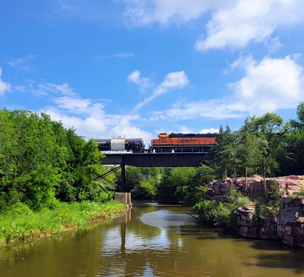 Train passing over lake at site Split Rock Park Campground