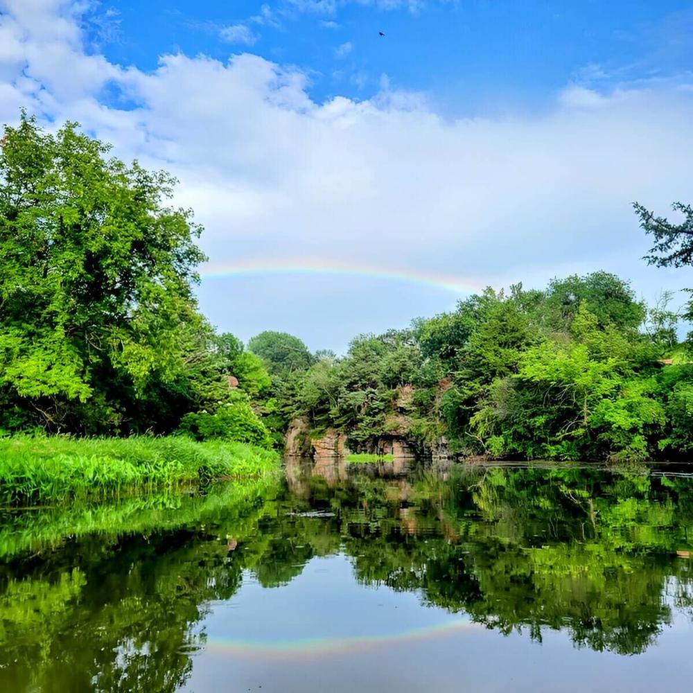 Rainbow over lake at site Split Rock Park Campground