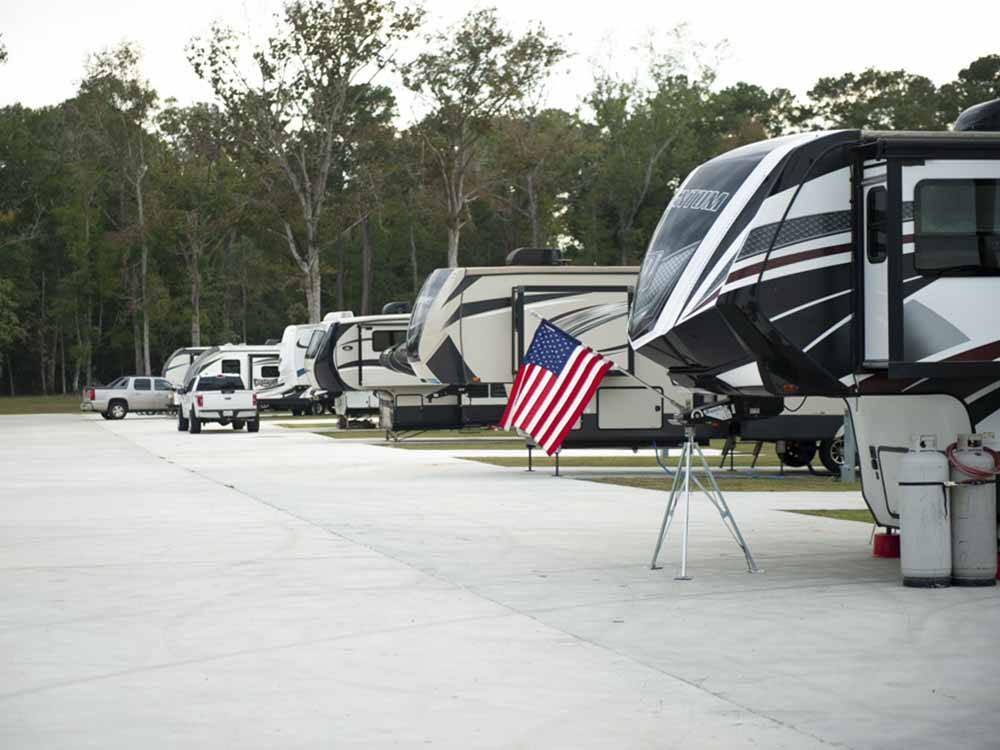 A row of fifth wheel trailers at ROYAL OAKS RV PARK