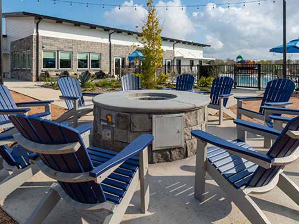 Chairs circling a fire pit at JETSTREAM RV RESORT AT THE MED CENTER