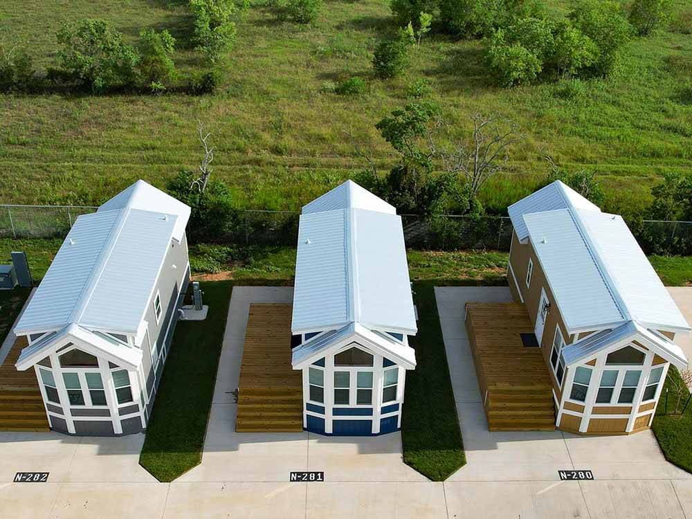 A drone shot of rental cottages at JETSTREAM RV RESORT AT WALLER