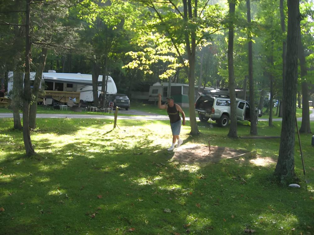 Parked RV at site Country Charm Campground