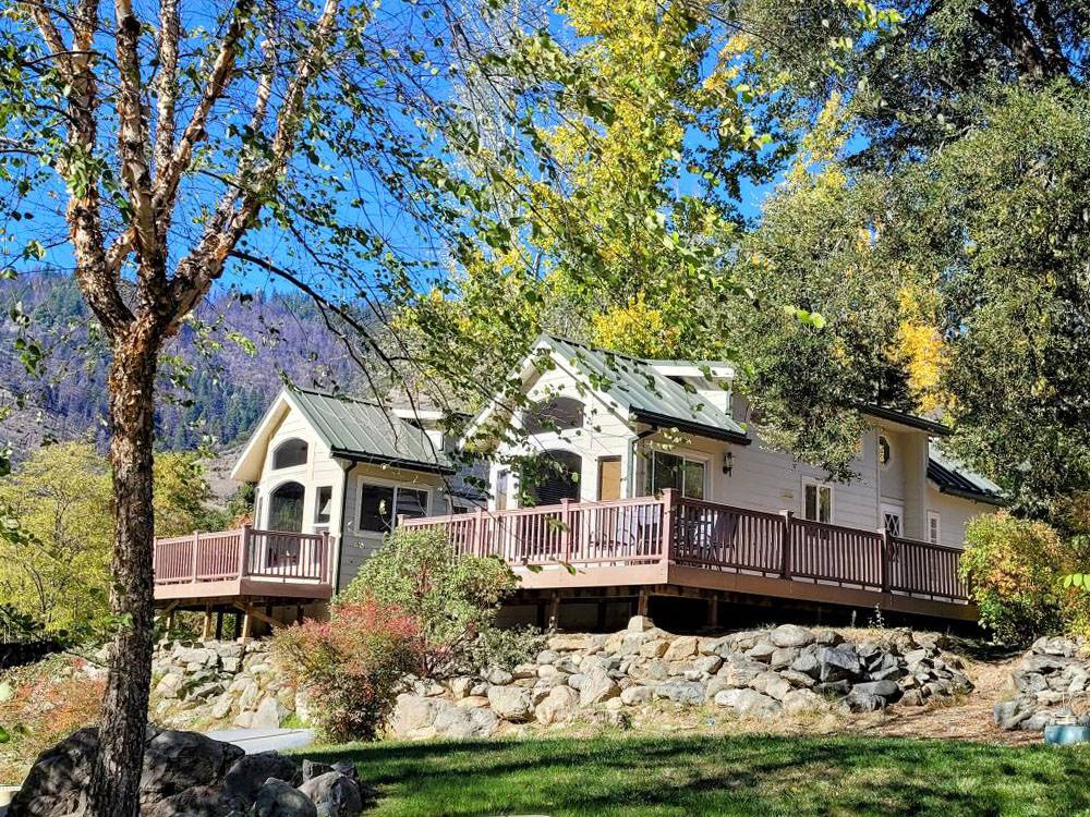 Two rental cabins perched on a hill