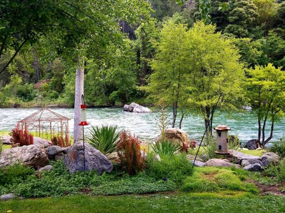 The river beyond beautiful landscaping