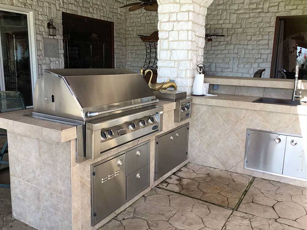 A stainless steel bbq pit at IRON HORSE RV RESORT