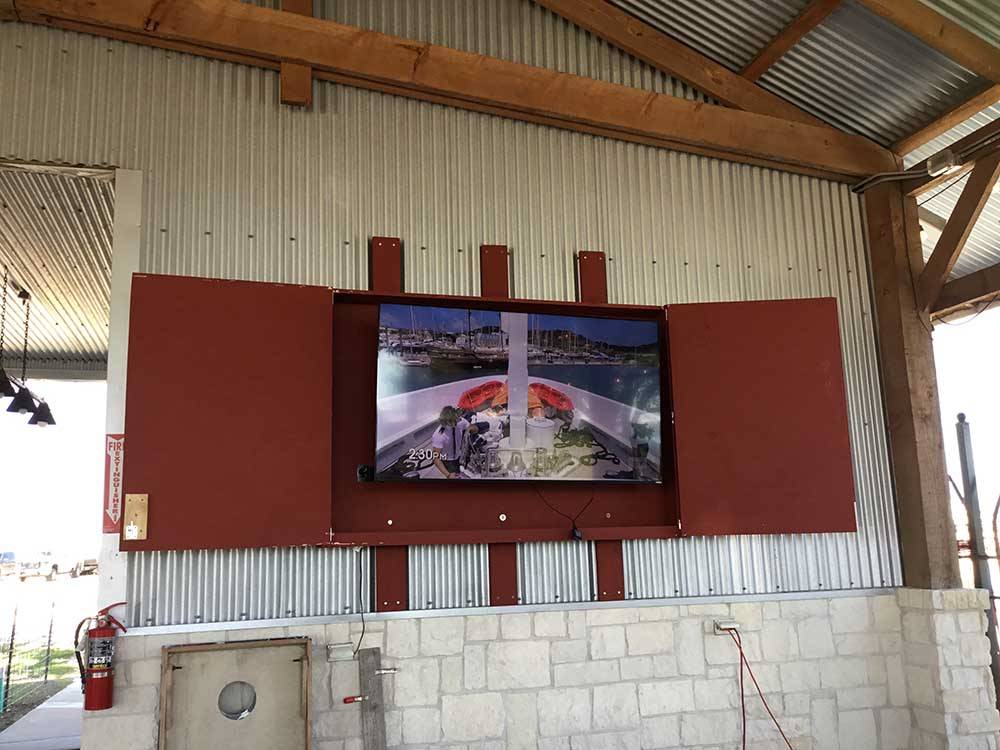 The enclosed hanging television at IRON HORSE RV RESORT