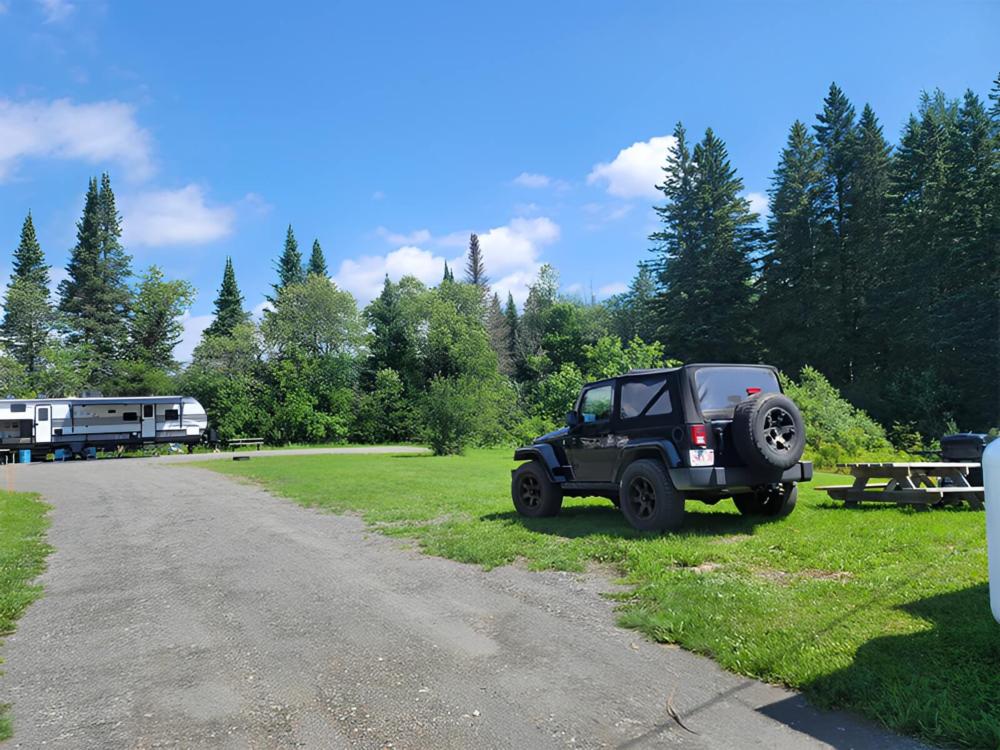 Jeep parked in grassy site