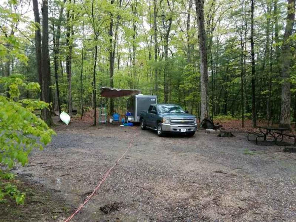 RV in gravel site at Lake Heron Retreat