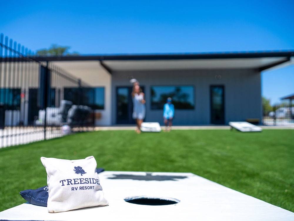 People playing cornhole
