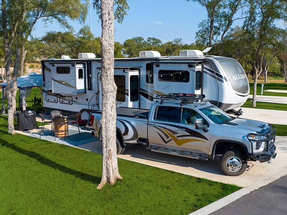 A truck and fifth wheel at a site