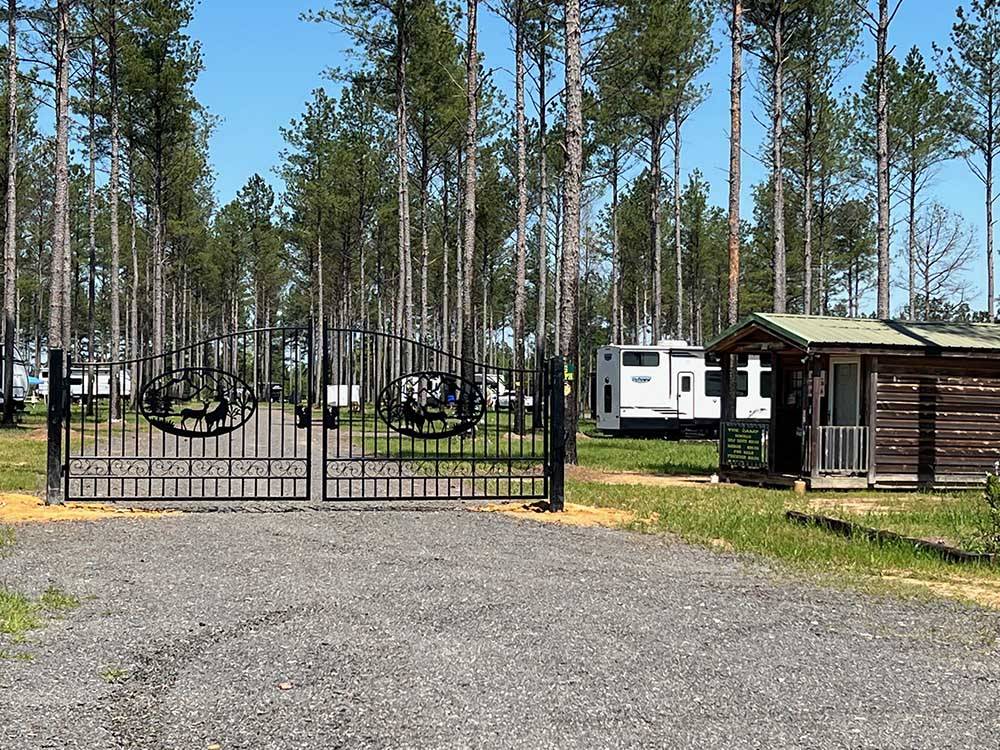 The front entrance metal gate at DREAM RV PARKS