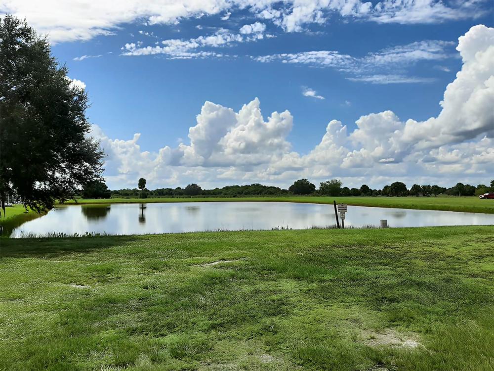 Red truck near a pond at Twin Palms Resort