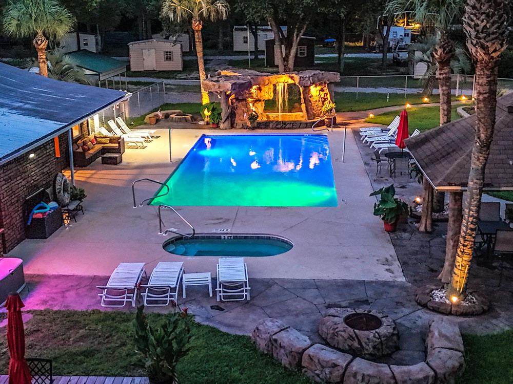 The pool area at night at VACAY VILLAGE OF PENSACOLA