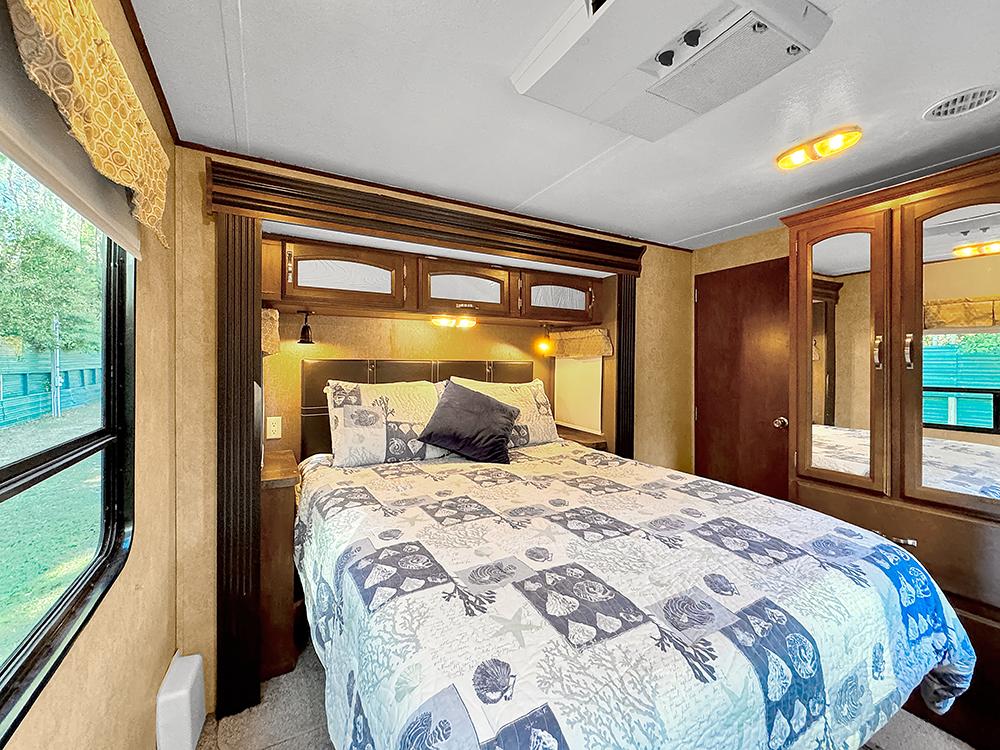 Interior of a motorhome bedroom at VACAY VILLAGE OF PENSACOLA