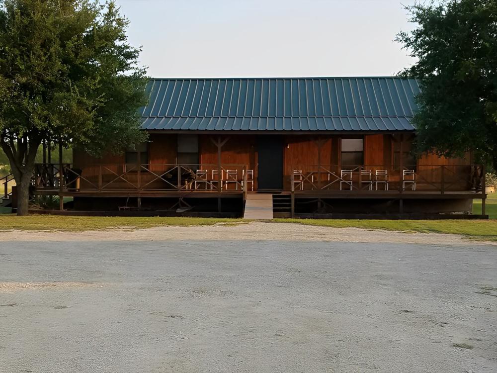 Wooden table on a wooden deck at M Bar H Lodge and RV Park
