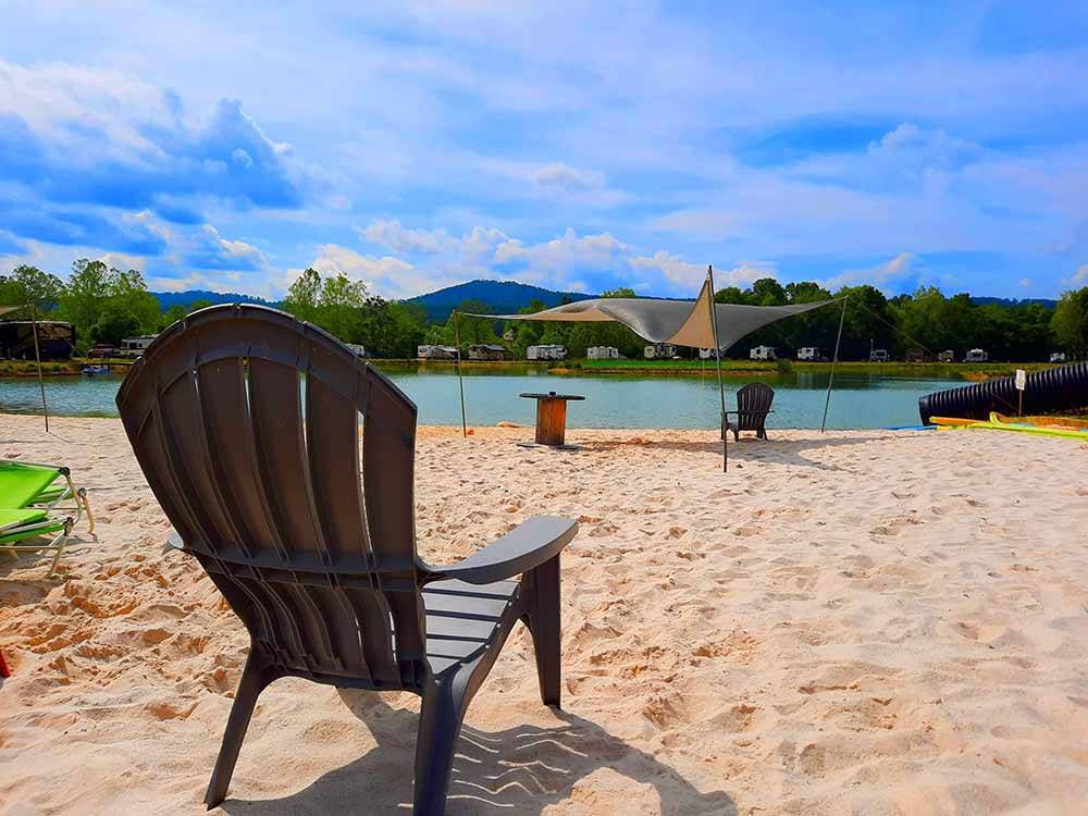 Chairs in the sand by the lake at MAMMOTH RIDGE RV PARK
