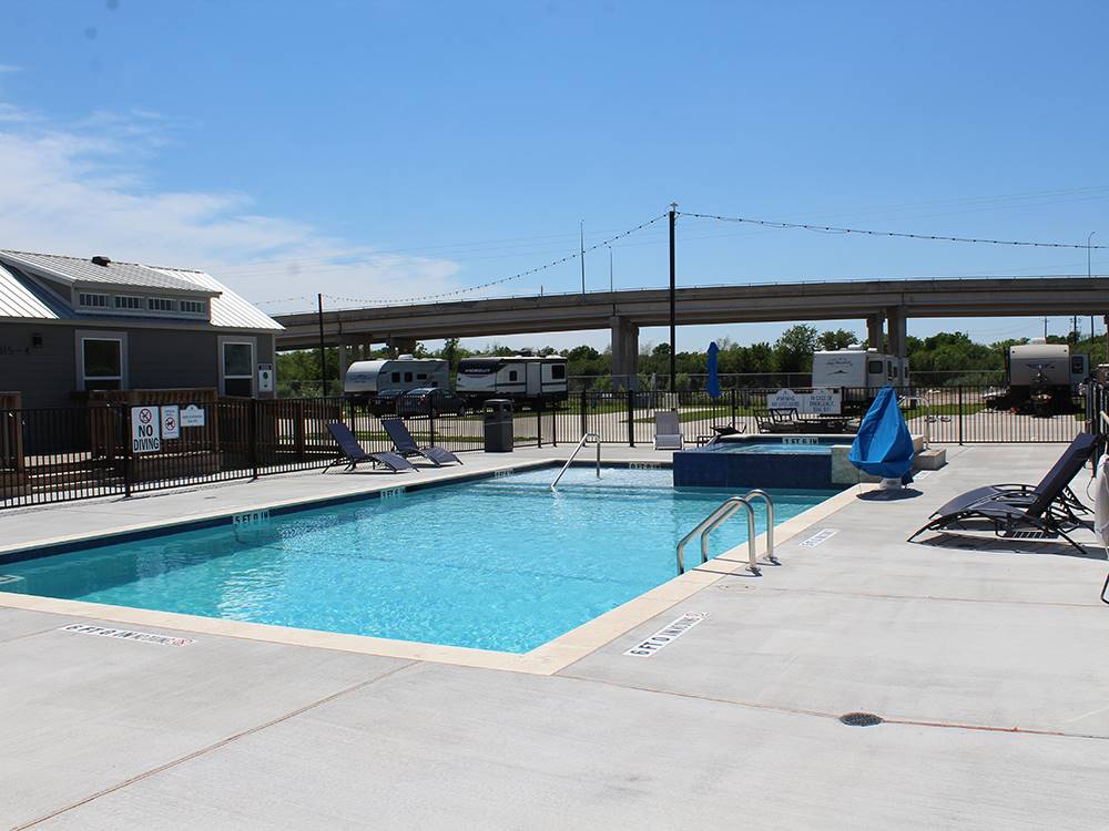 Pool area with bridge in background at Medical Center RV Resort