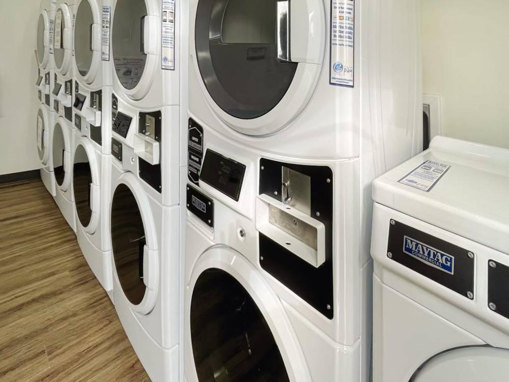 Laundry room with stacked washers and driers at Medical Center RV Resort