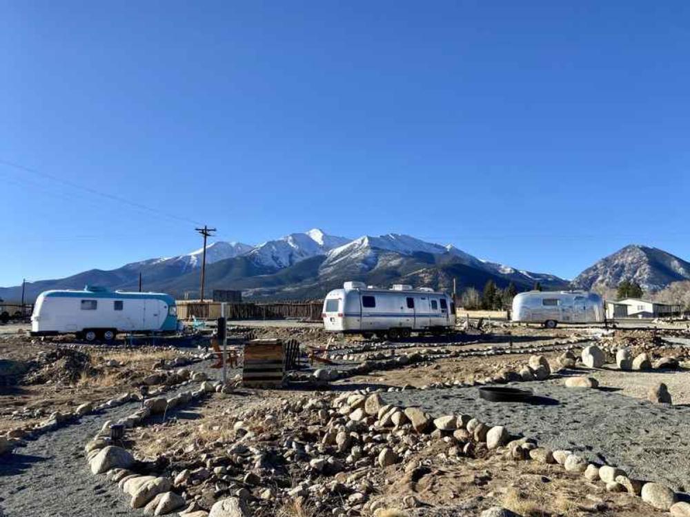 Vintage trailers and snow-capped mountains at MoonStream Vintage Campground