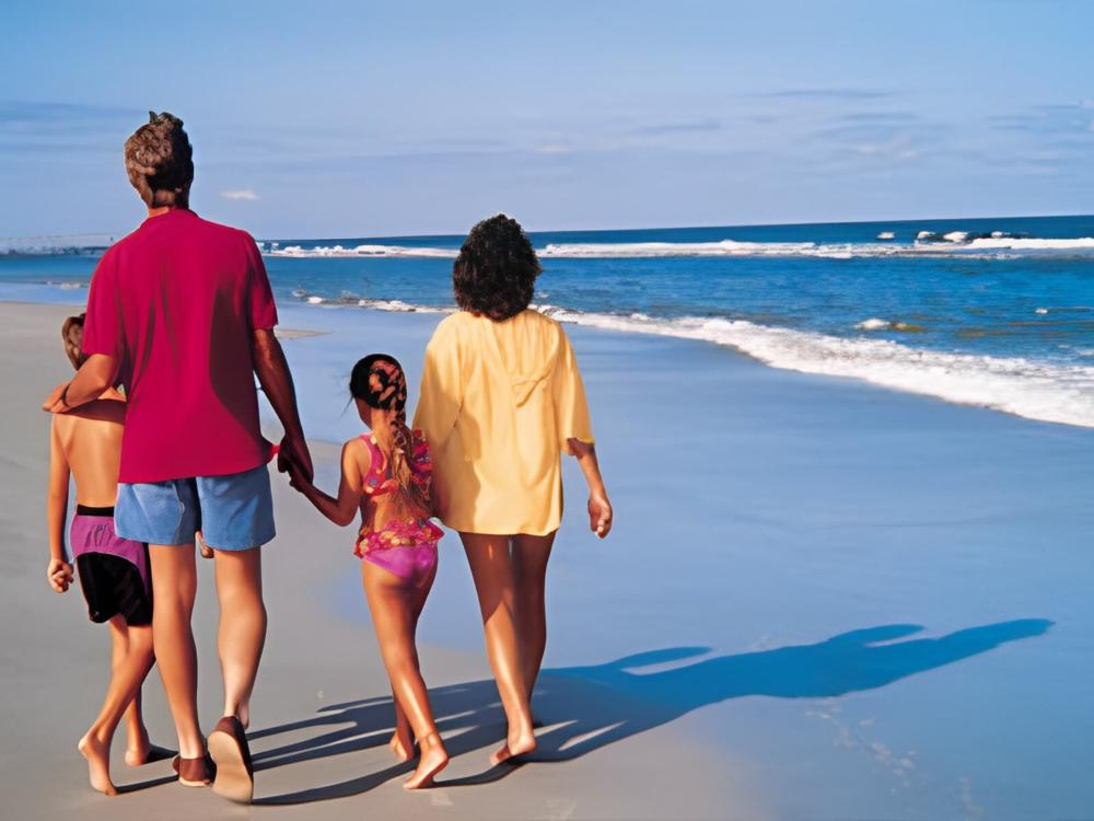 A family walking on the beach