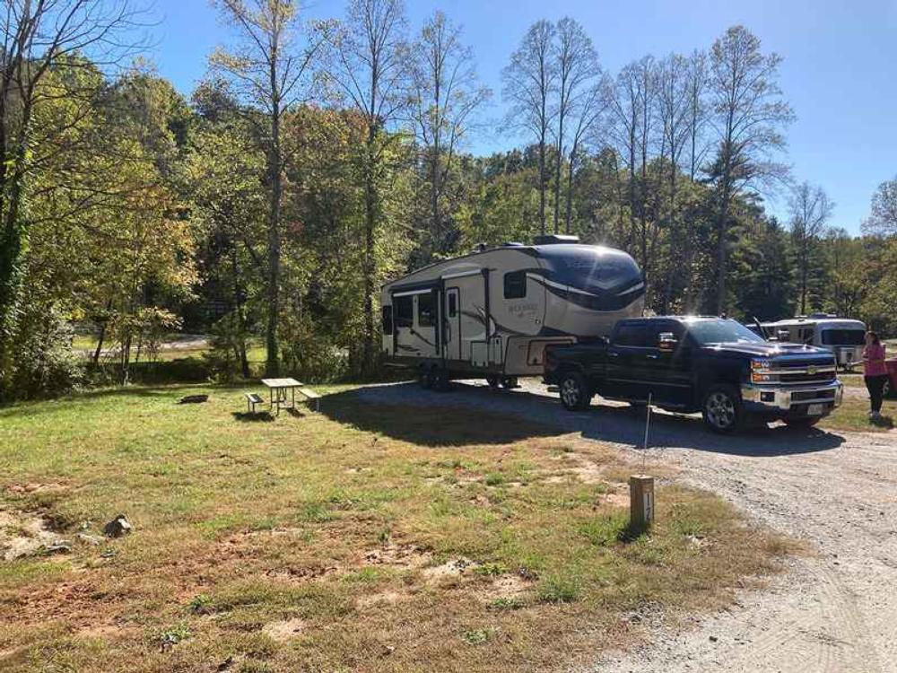 Site by trees at Emberglow Outdoor Resort