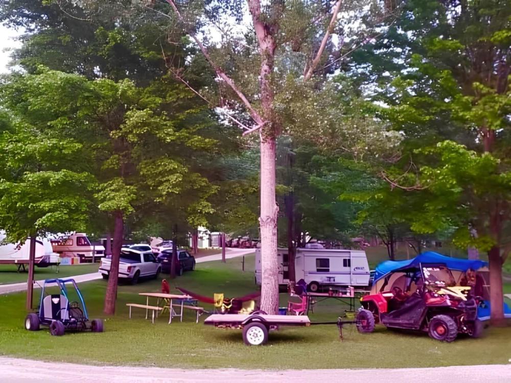 A campsite with ATVs