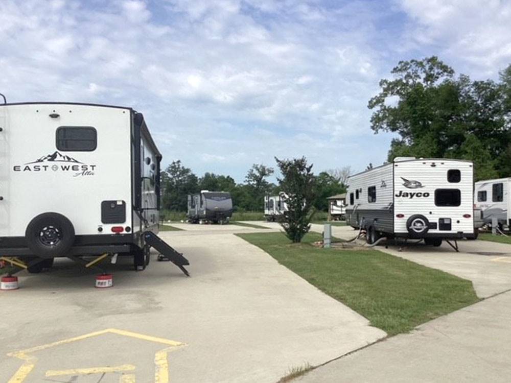 Paved sites flanked with grass at Gator RV Park