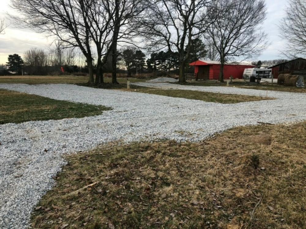 Gravel sites and red barn at Peaceful Acres at Plato's Branch
