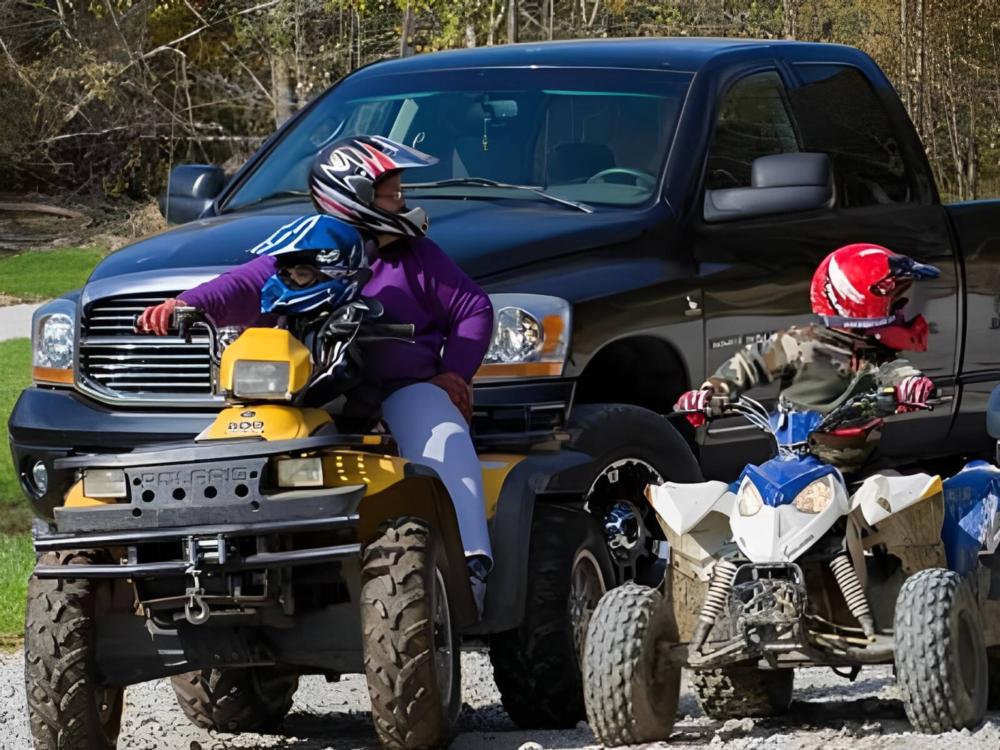 People riding ATVs