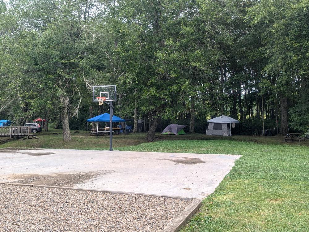 A row of tents in sites at PIPESTEM RV PARK AND CAMPGROUND